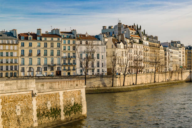 Riverfront apartment buildings at sena river, paris, france