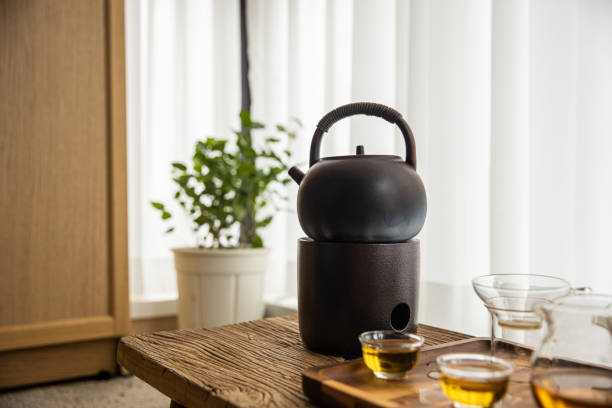Chinese tea ceremony teapot and tea cup on wood table