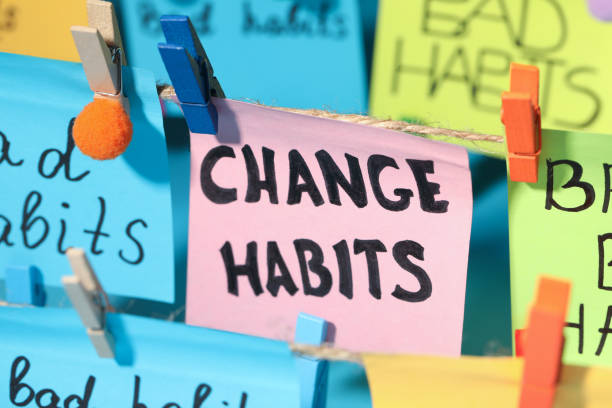 istock Different paper notes hanging on ropes, closeup. Change Habits 1428730514