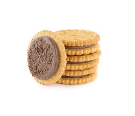 Tasty sandwich cookies with chocolate cream on white background