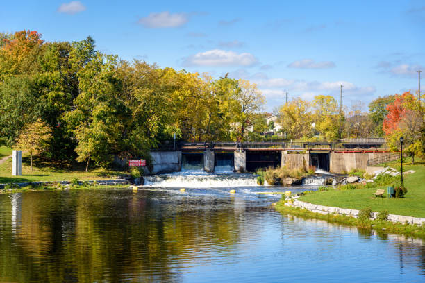 istock Old dam along a river on a clear autumn day 1428734716
