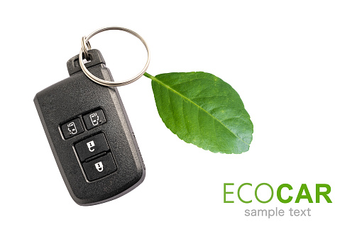 Eco car, Car key with green leaf, electric energy green environment ecology concept.