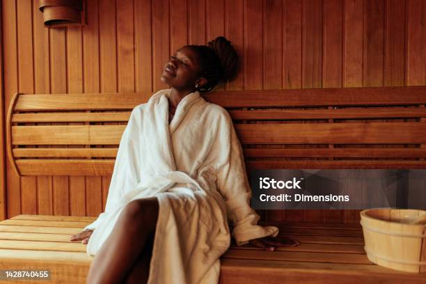 Young Black Woman Enjoying In Sauna Stock Photo - Download Image Now - Spa, Women, One Woman Only