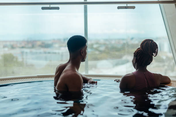 istock Couple in hot tub enjoying view. 1428741664