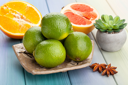 lime on a plate on wood background