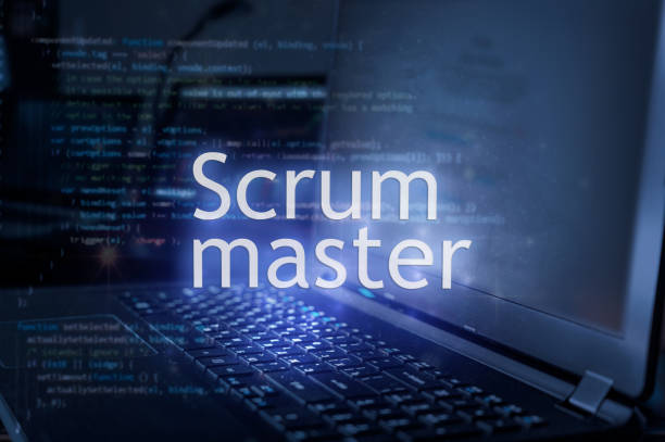 Scrum master inscription against laptop and code background. stock photo