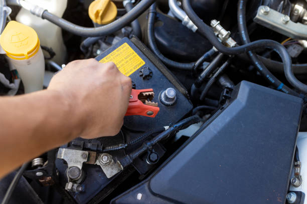 istock Car Battery Repair - Connecting Jumper Cables 1428749798