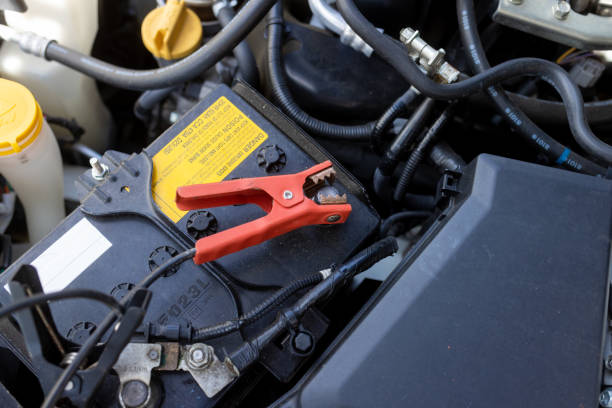 istock Jumper Cables Connected to Car Battery 1428749996