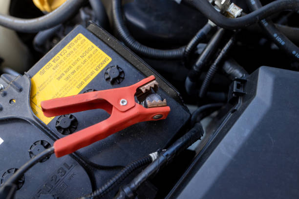 istock Jumper Cables Connected to Car Battery - Positive Post 1428750064