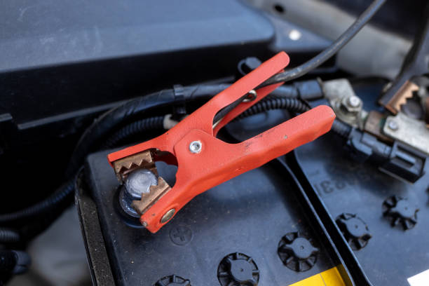 Jumper Cables Connected to Car Battery