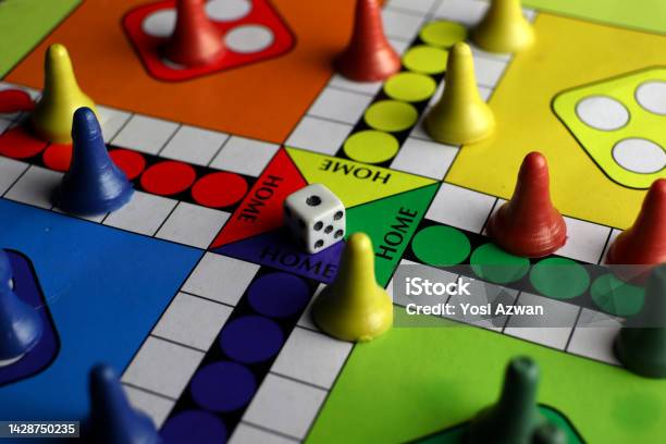 Playing Board Games With Dice Colorful Board And Pieces Stock Photo - Download Image Now