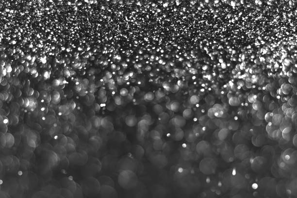 istock Gray black sparkling glitter bokeh background 1428750823