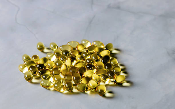 istock Yellow capsules with food supplement omega three 1428752097