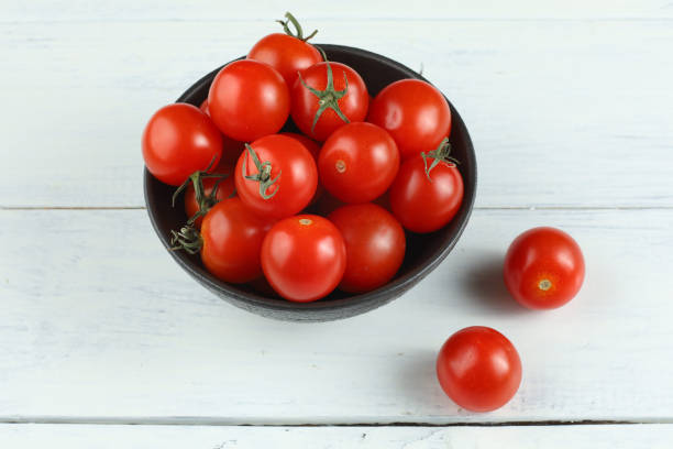 istock Red cherry tomato in a bowl 1428754567