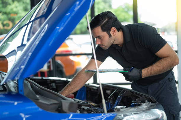 istock Mechanic Asian man close up using laptop computer and diagnostic software to tuning fixing repairing car engine automobile vehicle parts using tools equipment in workshop garage support services 1428754579