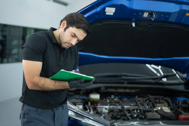 istock Mechanic Asian man close up using laptop computer and diagnostic software to tuning fixing repairing car engine automobile vehicle parts using tools equipment in workshop garage support services 1428754748