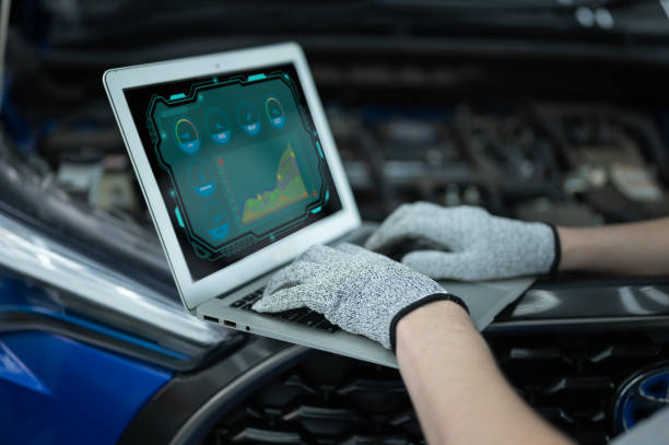 istock Mechanic Asian man close up using laptop computer and diagnostic software to tuning fixing repairing car engine automobile vehicle parts using tools equipment in workshop garage support services 1428755035
