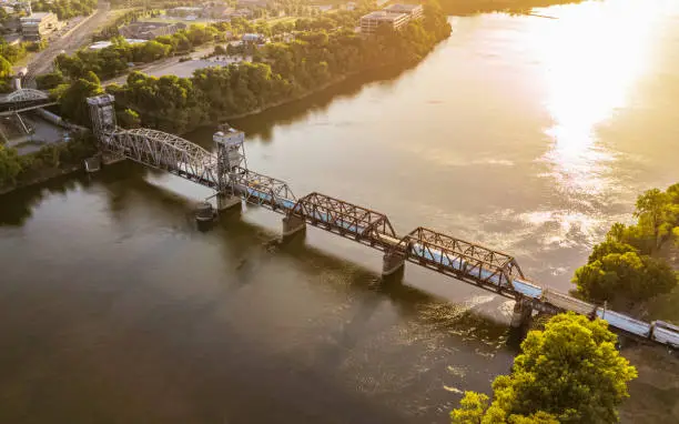 The sun begins to set over this railway bridge that crosses the Arkansas River in Little Rock, Arkansas.