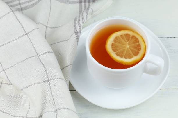 istock A cup of tea with lemon on the table. 1428757543