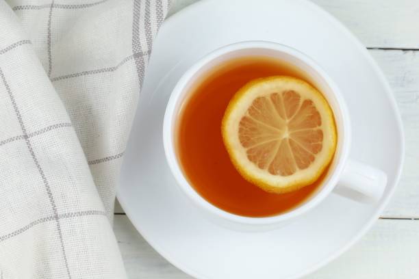 istock A cup of tea with lemon on the table. 1428757551