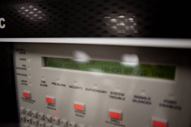 istock Fire alarm and mock sprinkler system attached to a white wall used for training 1428759499