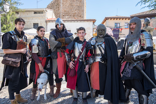 Castilla La Mancha, Spain - September 03, 2022: Group of men and women characterized as medieval warriors at the Fair of the town of Buitrago del Lozoya