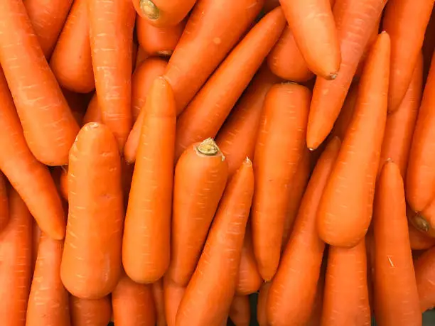 Close up of Textured image of carrots in department store shelves or supermarket