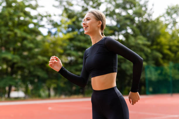 istock Fitness woman jogging on stadium outdoors workout 1428765209