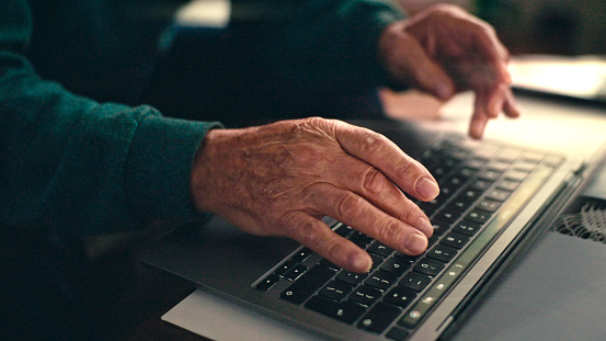senior using laptop