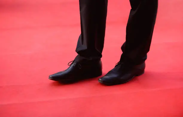 Photo of Man's shoes on the red carpet