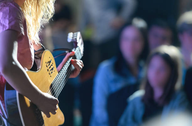 Playing the guitar at a concert stock photo