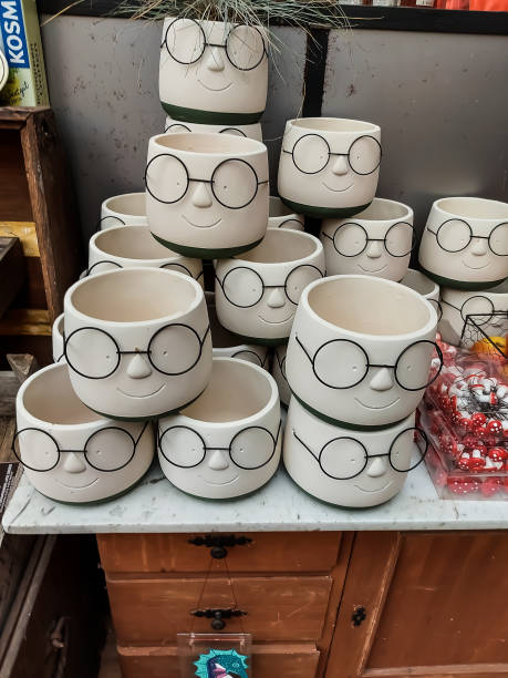 istock Decoration, flower pots with faces and glasses 1428771351
