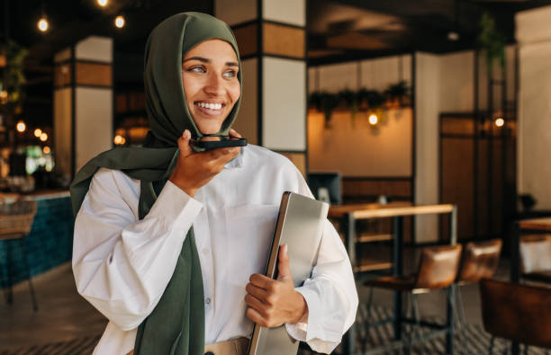 istock Muslim freelancer taking a phone call in a coffee shop 1428773699