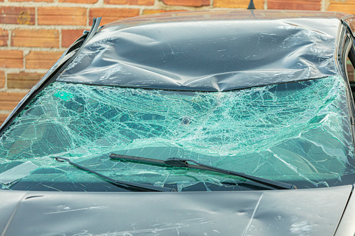 Broken windshield in real accident.