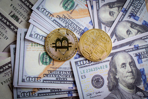 Istanbul, Turkey, September 22, 2022: Bitcoin cryptocurrency blockchain finance.bitcoin money on dollars. bitcoin concepts
