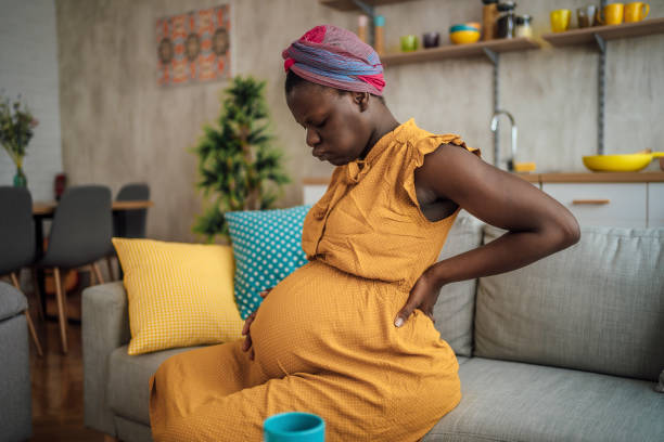 istock Pregnant woman suffering from backache 1428778736