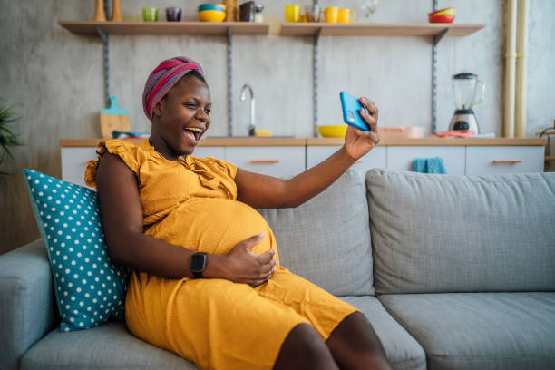 istock Pregnant woman making video call 1428779840