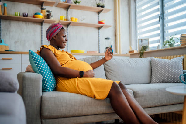 istock Pregnant woman making video call 1428779919