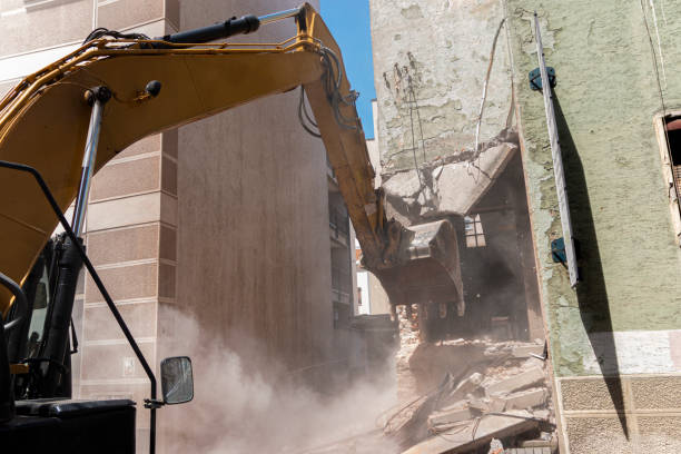 istock Excavator breaking house. Old building demolishing 1428782404