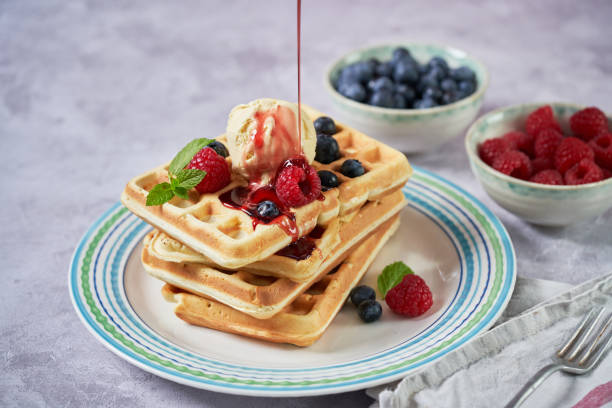 Making Waffles with Fresh Berries in Domestic Kitchen
