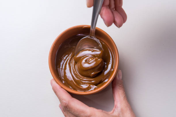 istock close up of spoon stirring dulce de leche 1428786105