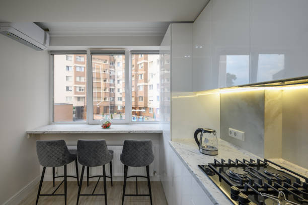 istock Interior of a modern white kitchen in a luxury studio apartmen 1428796975