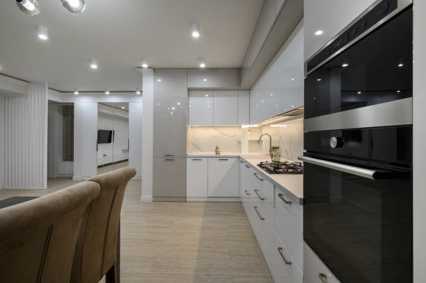 istock Huge white luxury kitchen in a studio apartment interior 1428797048