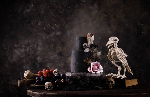 istock Halloween still life with skull, bones and cake 1428797216