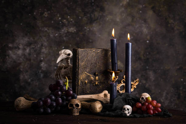 istock Halloween still life with skull, bones and cake 1428797223