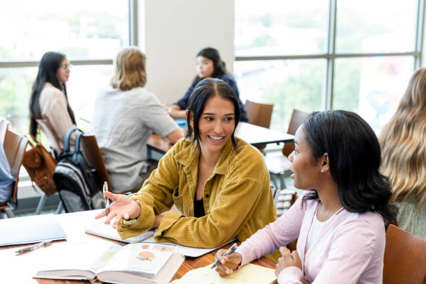 istock Female university student tutors female high school student 1428801936