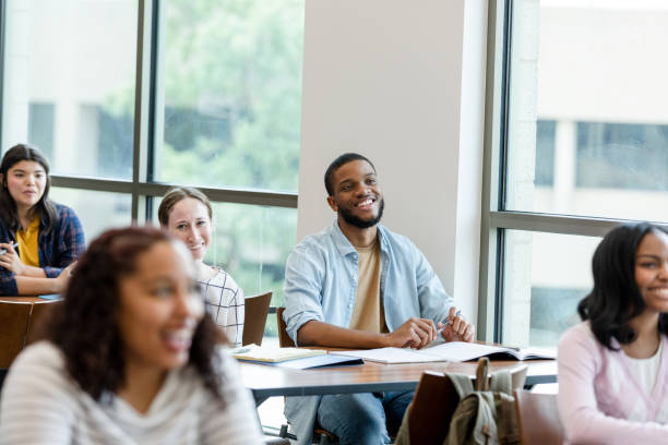 istock Multiracial group of young adults enjoy their college class 1428802045