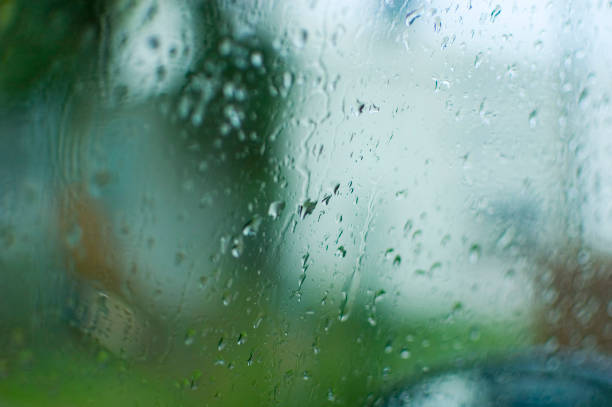 istock Close up of a glass surface covered in waterdrops. 1428802835