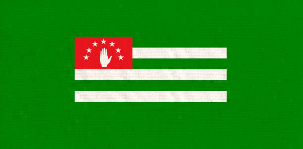 Flag of unrecognized country of Abkhazia. Flag of the Caucasian territory. Fabric texture. National symbol of Abkhazia on patterned background. Abkhazian country