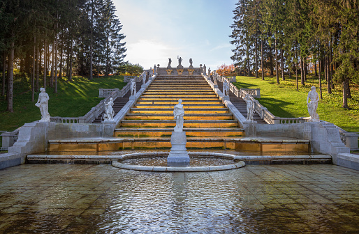 Peterhof, St. Petersburg, Russia - October 06, 2021: Fountain Cascade Golden Mountain with statues of ancient gods and heroes in Lower Park of Peterhof